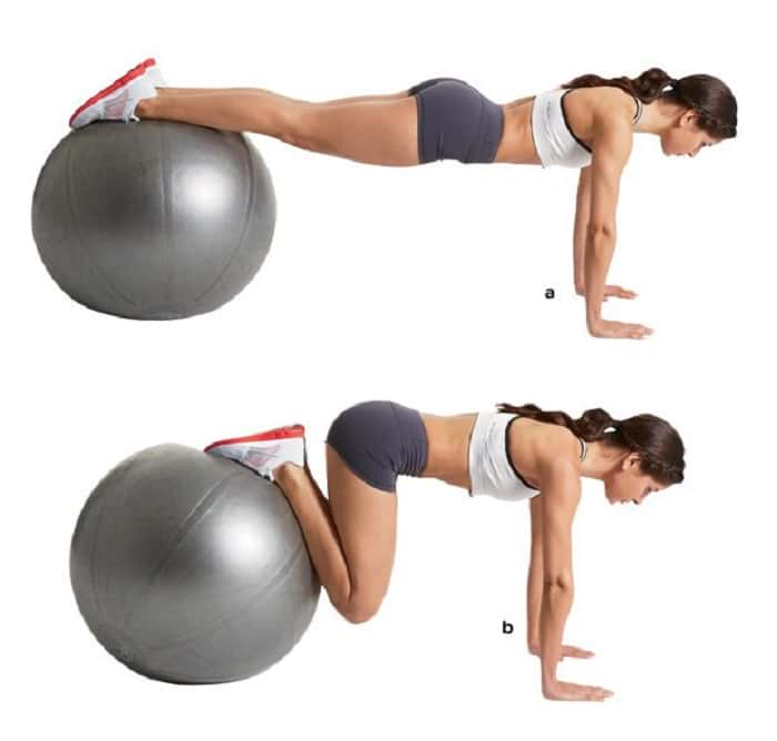 woman showing how to perform the Swiss Ball Jackknife https://get-strong.fit/Swiss-Ball-Jackknife-How-To-Exercise-Guide/Exercises